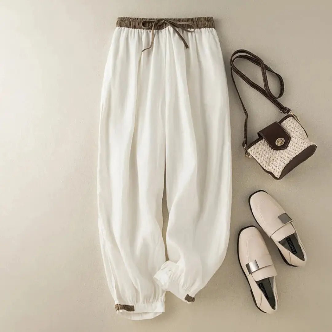 Lniane spodnie damskie – luźny krój, regulowane mankiety - Arkadya Outlet - Women Pants