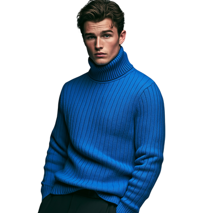 Młody mężczyzna z uczesanymi brązowymi włosami nosi męski golf Arkadya Outlet długi rękaw sweter dzianinowy w jasnoniebieskich i czarnych spodniach, pozując na prostym białym tle.