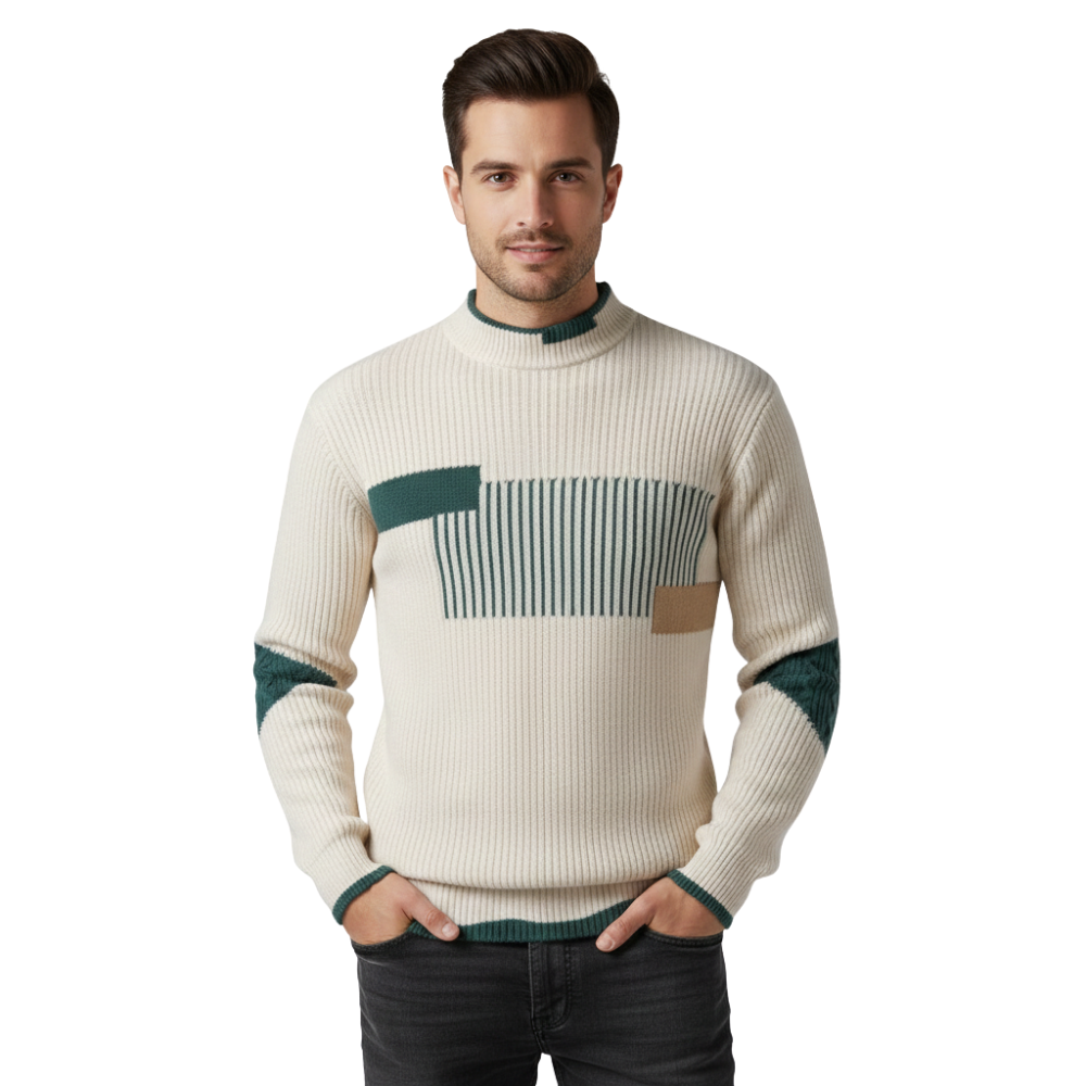 Mężczyzna o krótkich ciemnych włosach pozuje z rękami w kieszeniach, ubrany w ciemne dżinsy i Arkadya Outlet Sweter męski wysoki kołnierz geometryczny wzór konstrukcja. Patrzy bezpośrednio w kamerę.