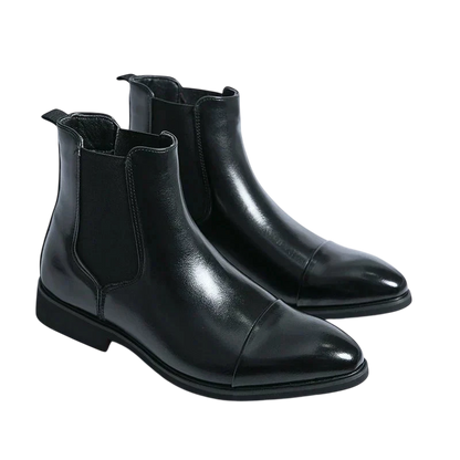 Botki Chelsea Męskie Antypoślizgowa Zamknięta Konstrukcja marki Arkadya Outlet: czarne, skórzane, z elastycznymi panelami, lekkim połyskiem i niskim obcasem na zimę, prezentowane na białym tle.