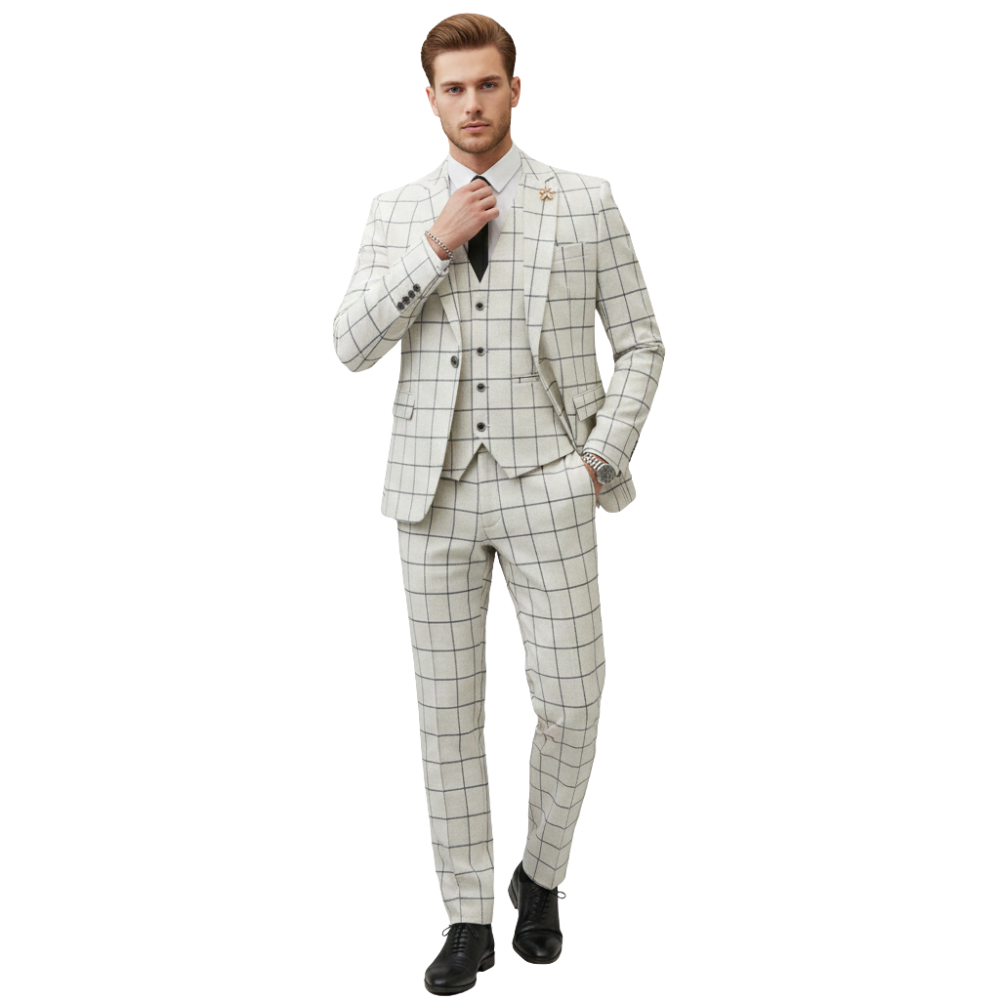 Mężczyzna stoi pewnie, trzymając klapę marynarki, ubrany w Arkadya Outlet Komplet Garniturowy Męski Trzyczęściowy Marynarka - białą z czarnym wzorem w paski, dopasowaną kamizelkę, czarny krawat i buty.