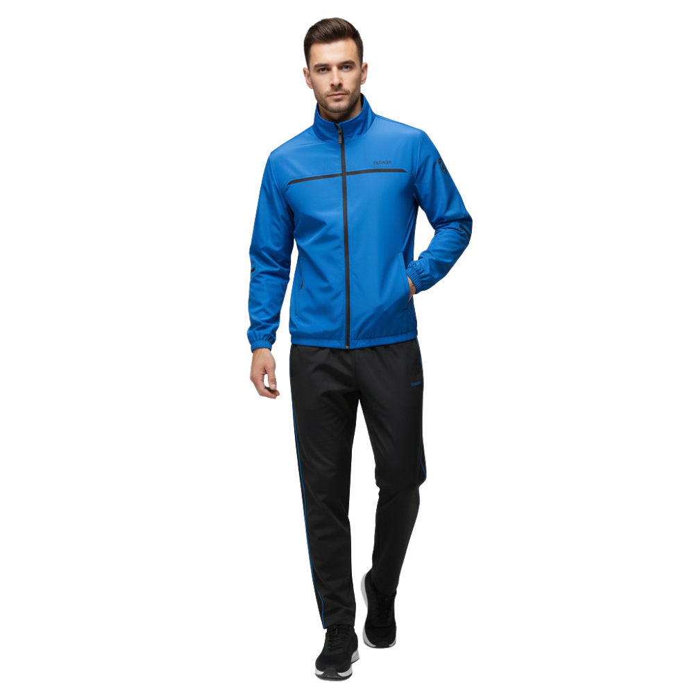 Mężczyzna w Arkadia Outlet Dres komplet męski dwuczęściowy - niebieski bluza na zamek i czarne spodnie - idzie przed siebie w czarnych trampkach na białym tle.