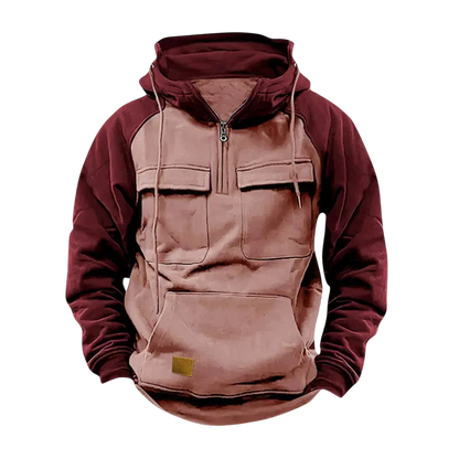 Męska Bluza od Arkadia Outlet to dwukolorowa bluza z bordowymi rękawami i kapturem, jasnobeżowym korpusem, zamkiem błyskawicznym z przodu, zapinanymi na zamek kieszeniami na piersi, przednią kieszenią i małą brązową naszywką na dole z przodu.