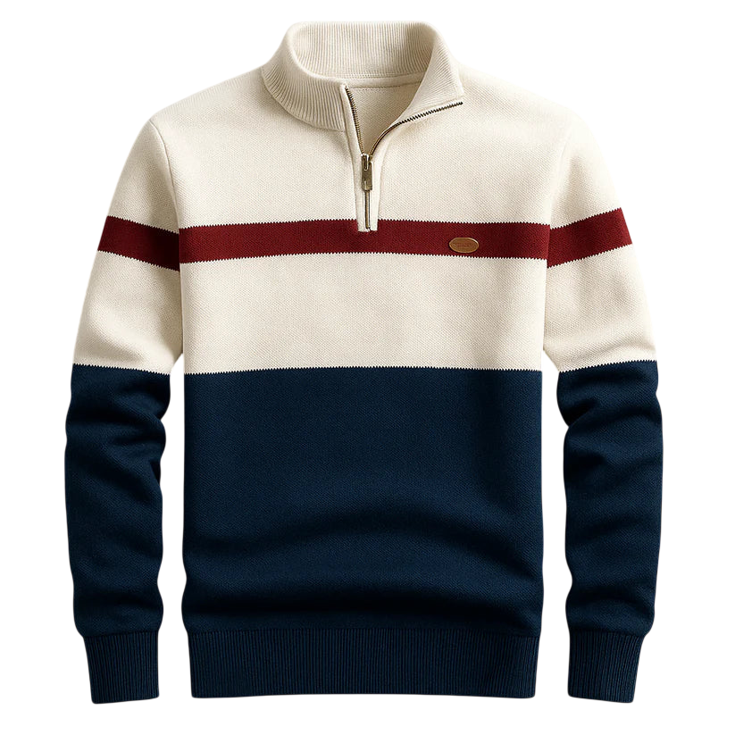 Sweter Arkadya Outlet Męski to kolorowy sweter z długim rękawem, kremową górą, bordowym paskiem na piersi i granatową dolną częścią. Posiada zapinany do połowy kołnierz i małą okrągłą naszywkę na lewej piersi.