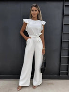 Kombinezon damski elegancki z dekoltem na jedno ramię – długie nogawki, asymetryczny krój - Arkadya Outlet - Women Jumpsuit