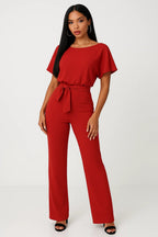 Kombinezon damski elegancki z paskiem w talii – szerokie nogawki, jednoczęściowy krój - Arkadya Outlet - Women Jumpsuit