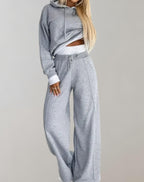 Komplet dresowy damski dwuczęściowy – bluza z kapturem i szerokie spodnie - Arkadya Outlet - Women Set