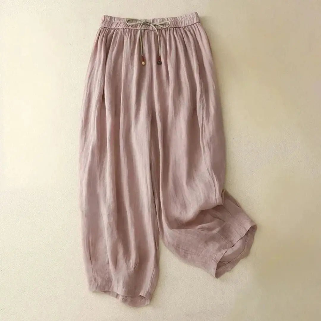 Lniane spodnie damskie – luźny krój, zwężana nogawka, kieszenie - Arkadya Outlet - Women Pants