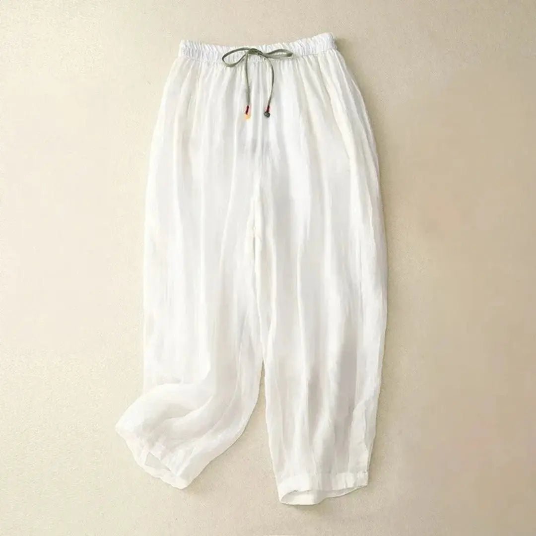 Lniane spodnie damskie – luźny krój, zwężana nogawka, kieszenie - Arkadya Outlet - Women Pants