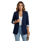 Marynarka damska dopasowana ze stójką i zapięciem na guziki – kieszenie z patkami - Arkadya Outlet - Women Blazer