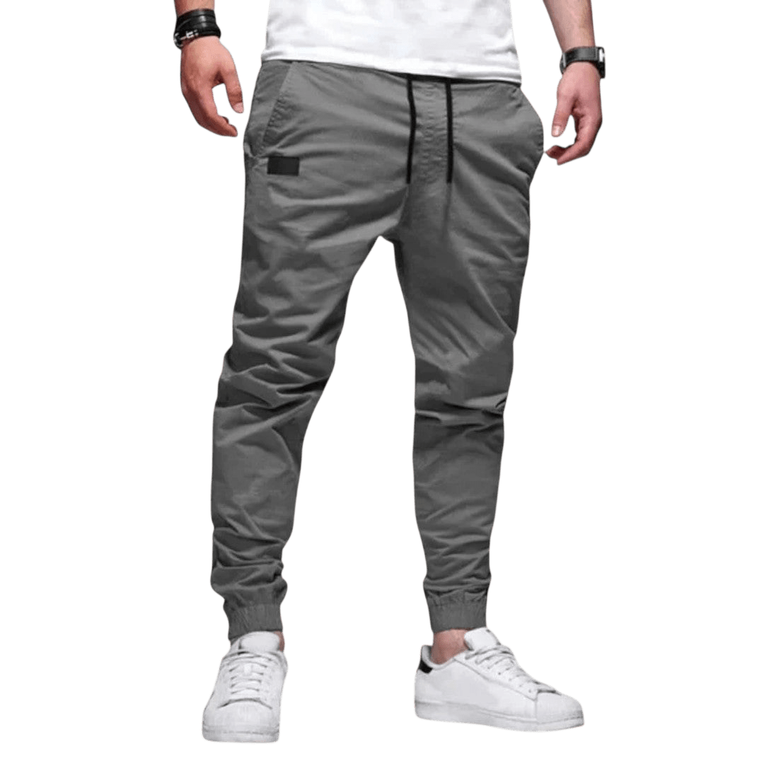 Spodnie joggerowe męskie krój slim ze ściągaczem w pasie i mankietach - Arkadya Outlet - Men Pants